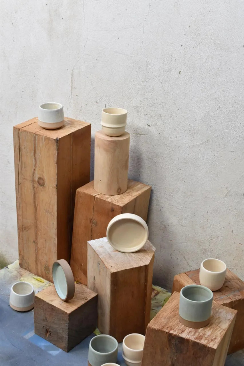 Handmade coffee cup and saucer sets in stoneware clay custom made for Qatar interior design company Remal