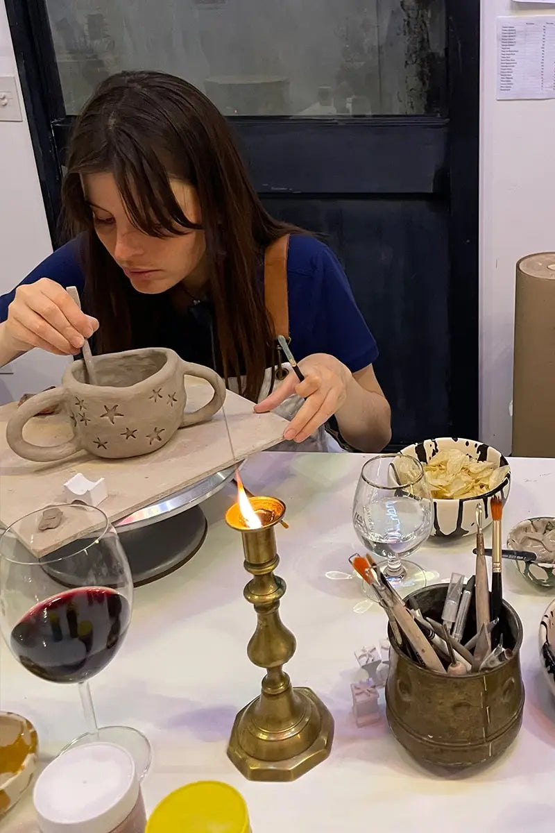 Student hand-building her own ceramic mug at OWO’s pottery class in Buenos Aires