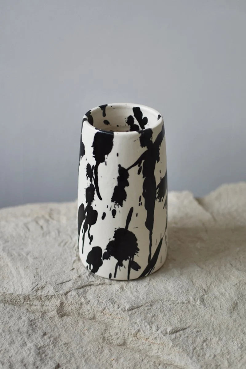 Handmade ceramic flower vase with hand-painted black splatters