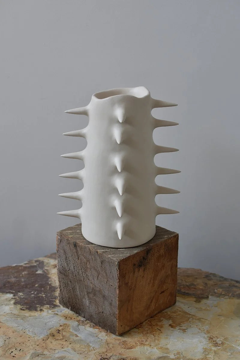 Handmade ceramic white decorative vase with spikes