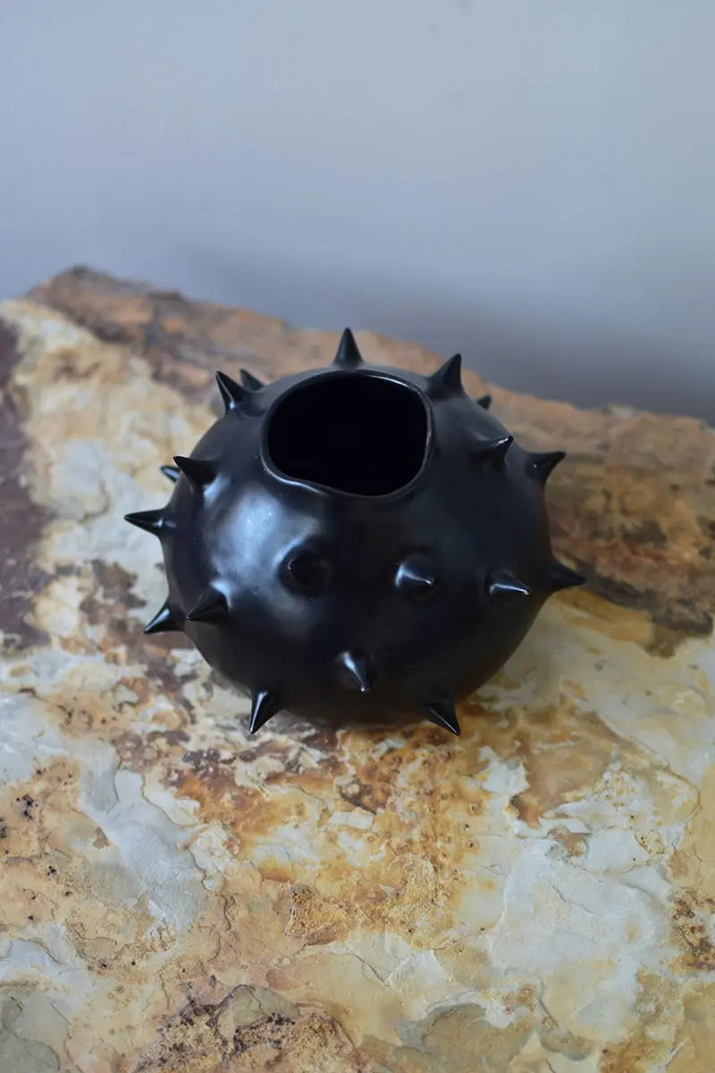 Handcrafted ceramic black round vase with spikes