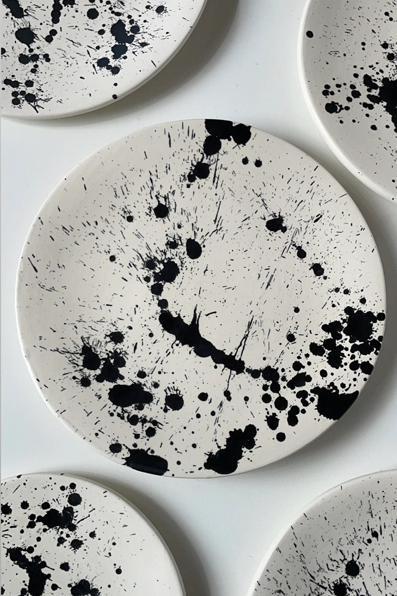 Handmade pottery dessert plate with hand painted black splatters by OWO Ceramics