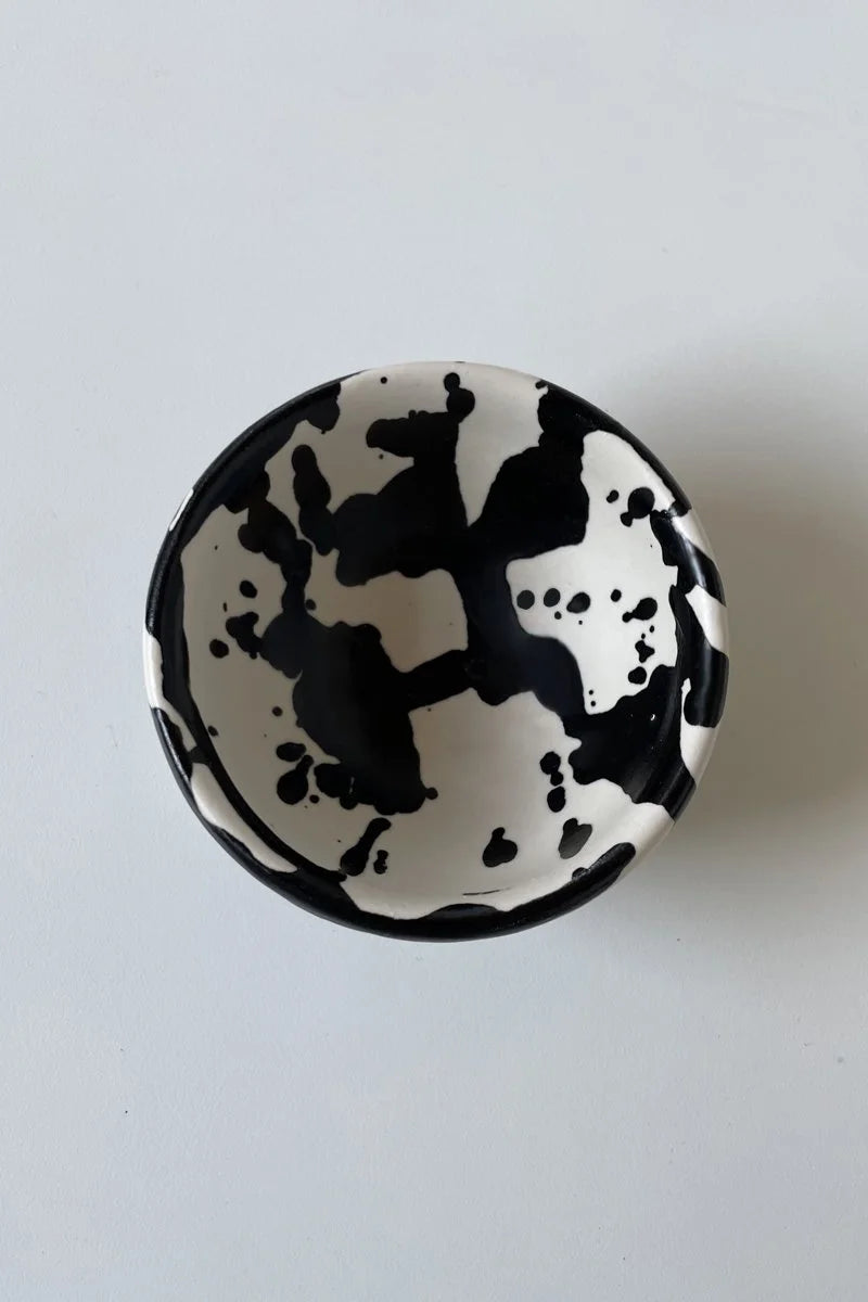 Handmade ceramic dipping bowl with hand-painted black splatters by OWO Ceramics