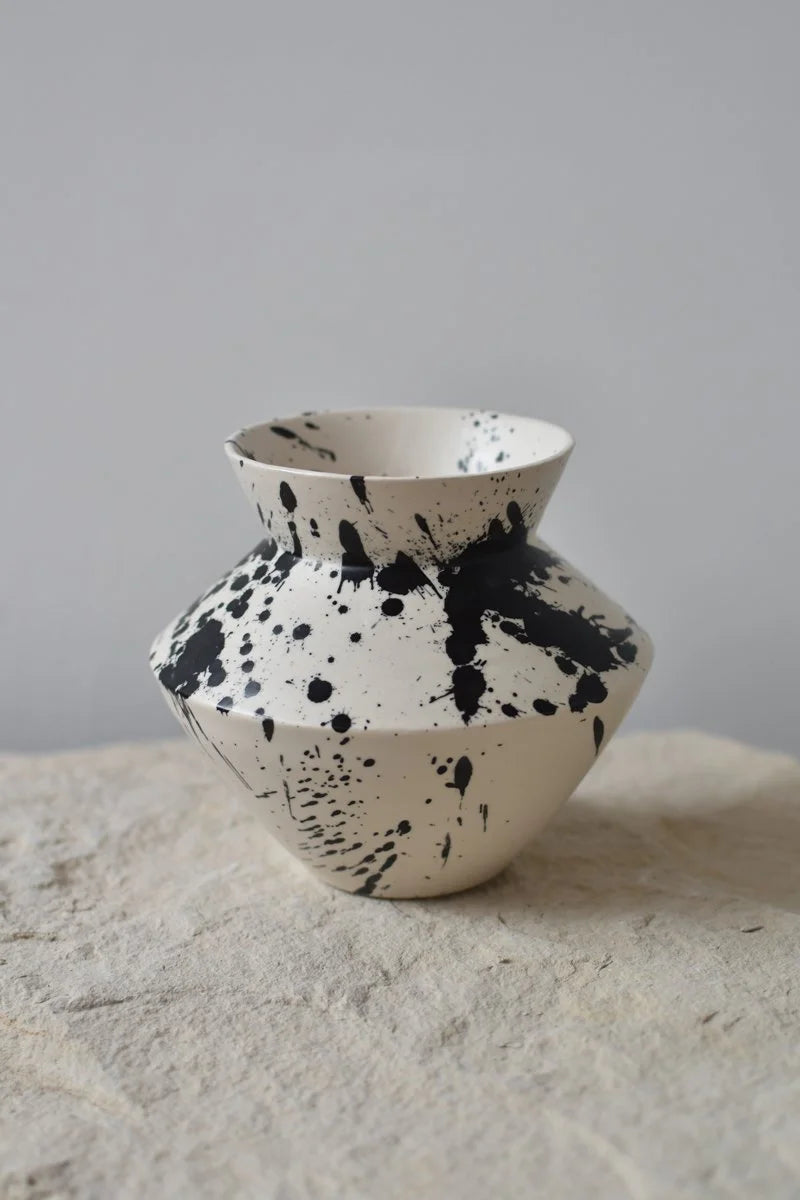 Handmade decorative ceramic vase with hand-painted black splatters