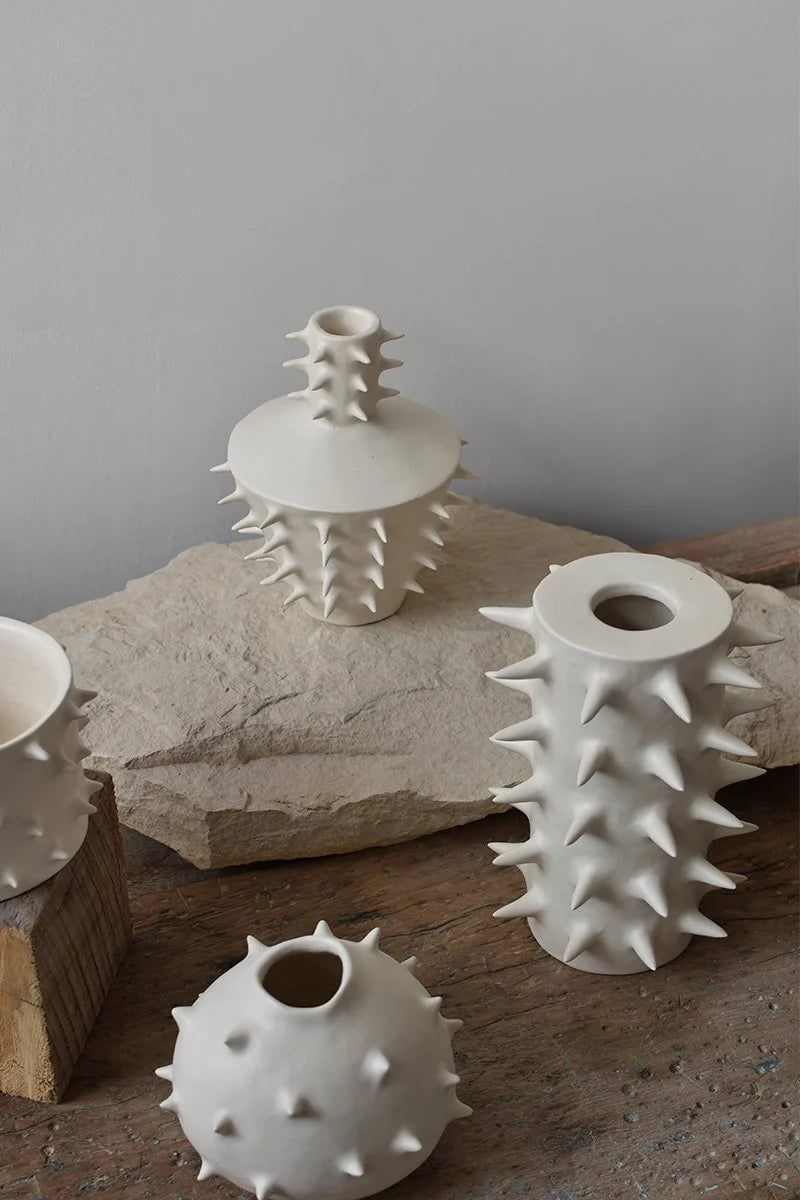 Decorative flower vases adorned with spikes, handcrafted by OWO ceramics