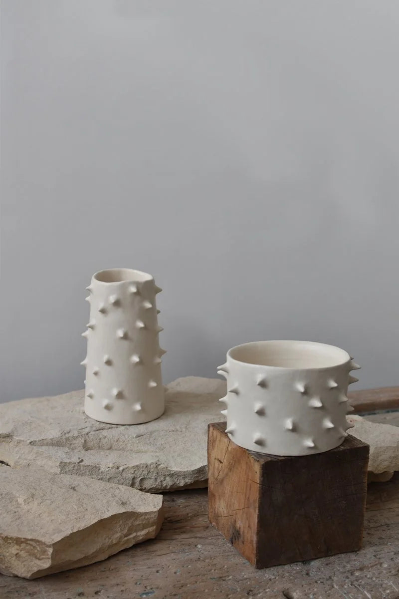 White ceramic vase and planter adorned with spikes, handcrafted by OWO ceramics