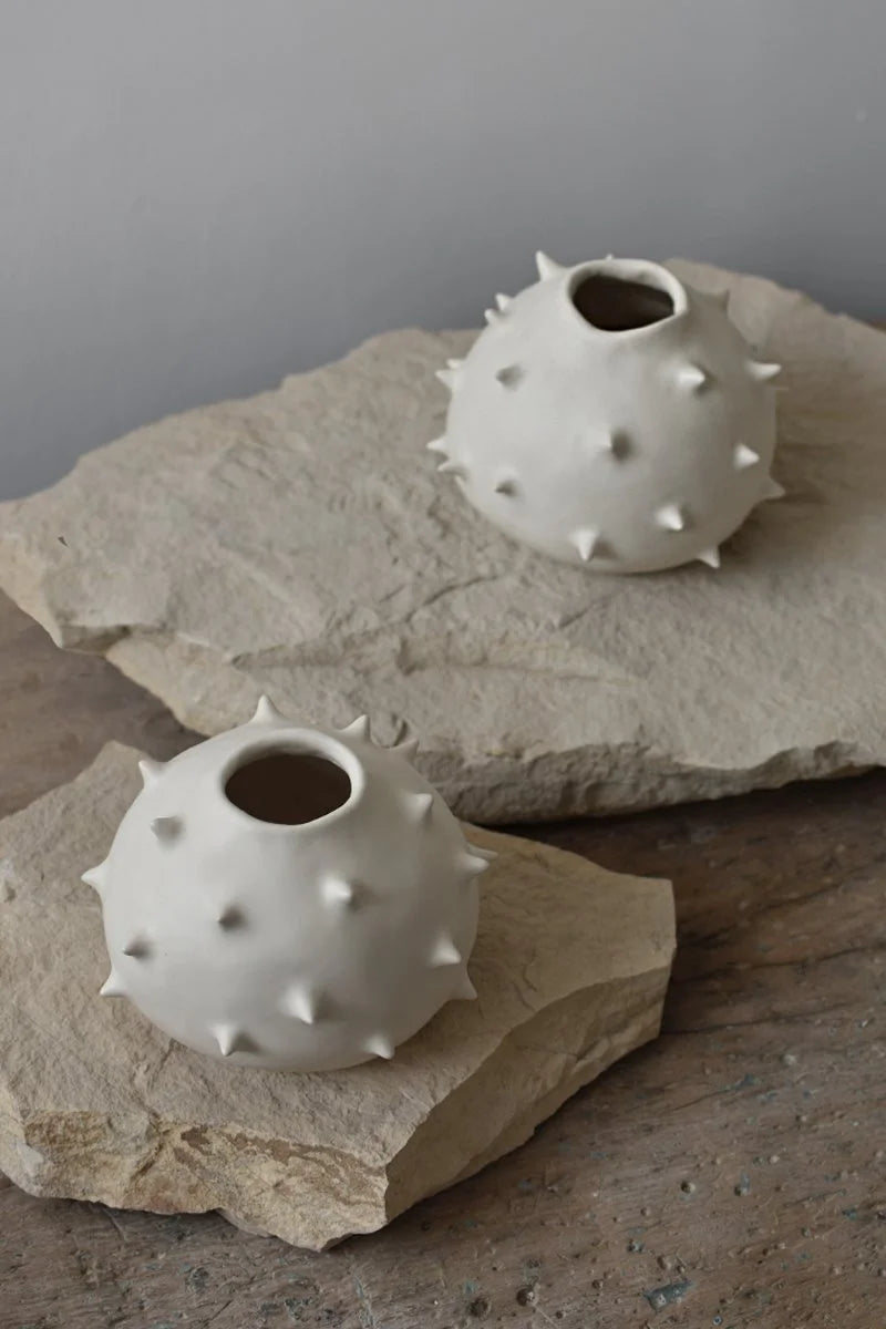 Handmade round white ceramic vases with spikes by OWO Ceramics