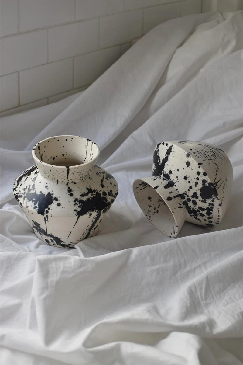 Handcrafted decorative ceramic vase with hand-painted black splatters
