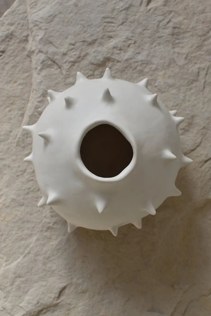 Upper view of white round ceramic vase with spikes, handmade by OWO Ceramics