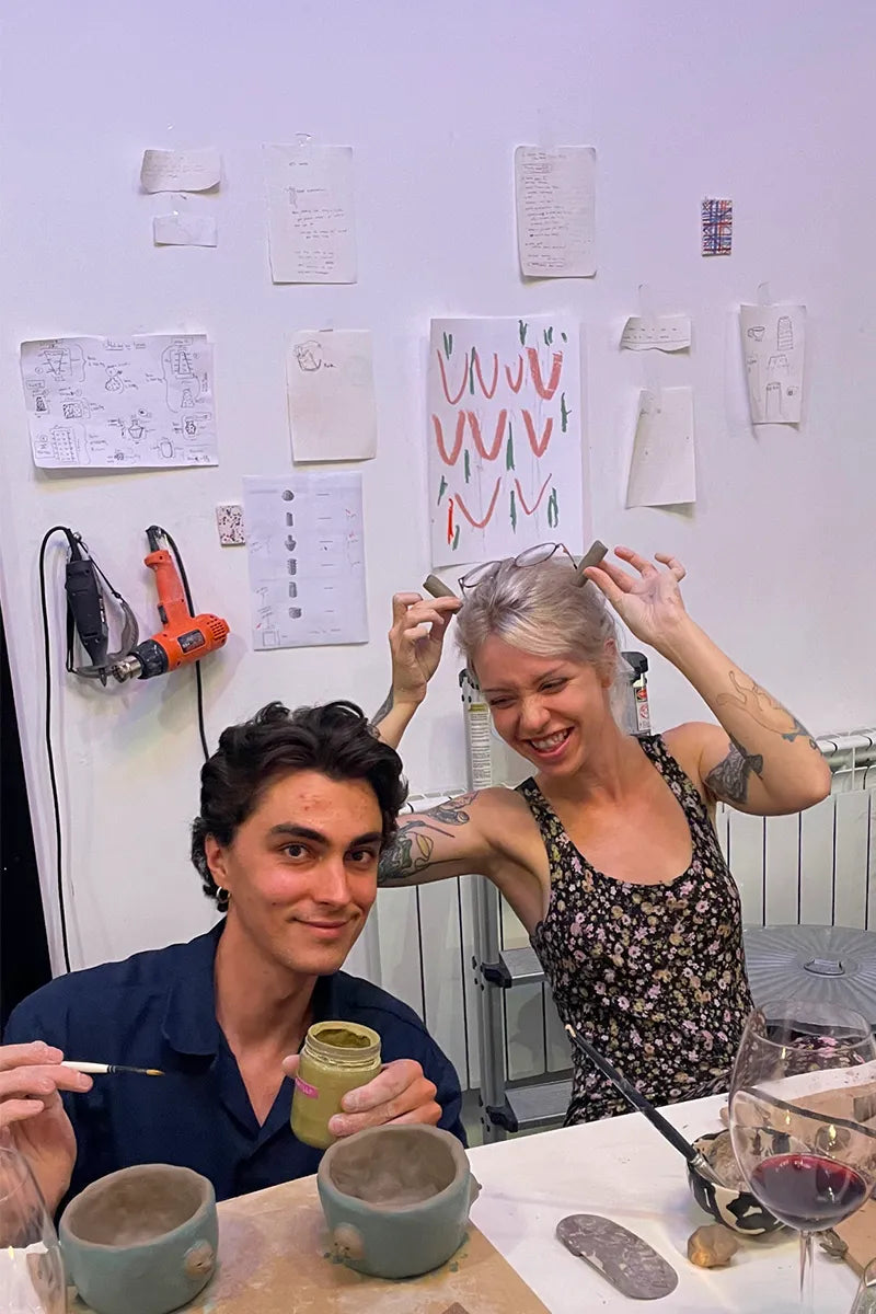 Couple crafting their own ceramic mugs at OWO’s art class in Buenos Aires