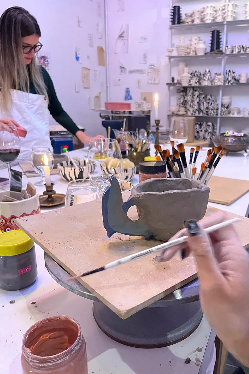 Student hand-building her own ceramic mug at OWO’s pottery class in Buenos Aires